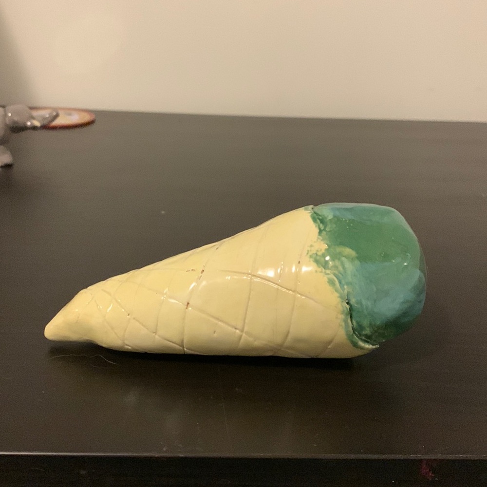 Folk art ice cream cone sculpture made out of clay